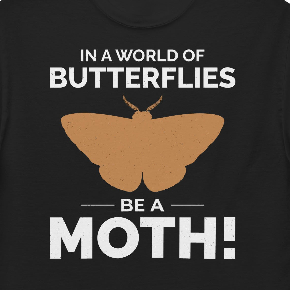 T-shirt with 'In a World of Butterflies, Be a Moth' text