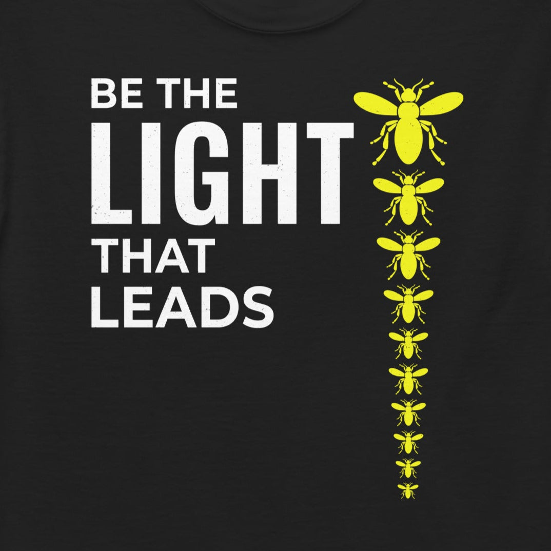 T-shirt with 'Be the Light That Leads' text