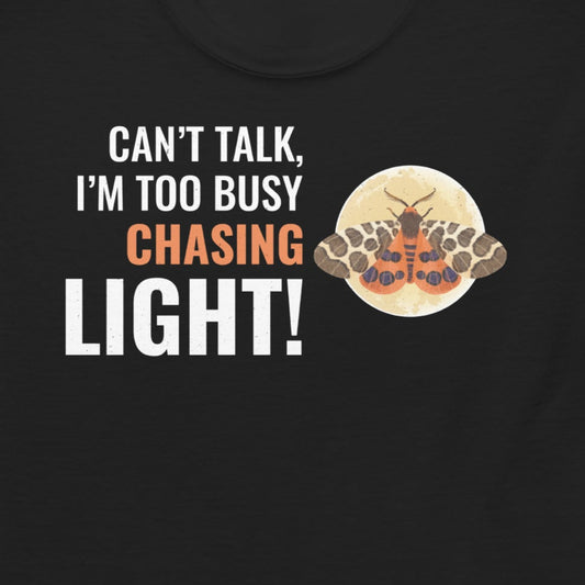 T-shirt with 'Can’t Talk, I’m Too Busy Chasing Light!' text.