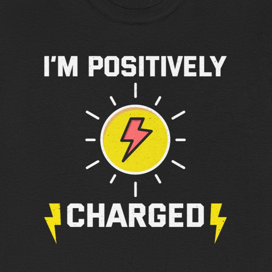 Electrician T-Shirt with "I'm Positively Charged" text, a lightning bolt in a sun, and lightning bolt graphics.
