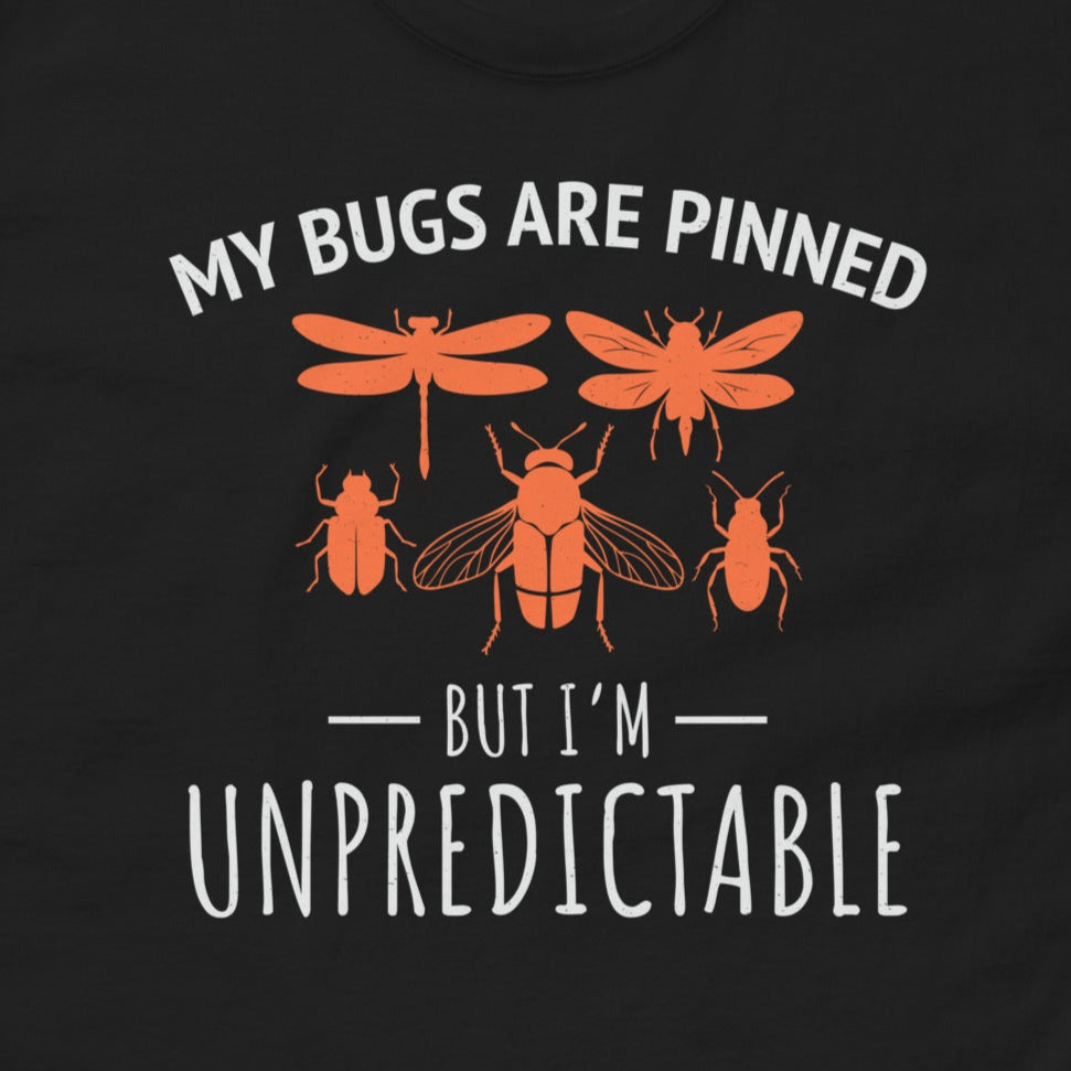 T-shirt with 'My Bugs Are Pinned But I'm Unpredictable' text